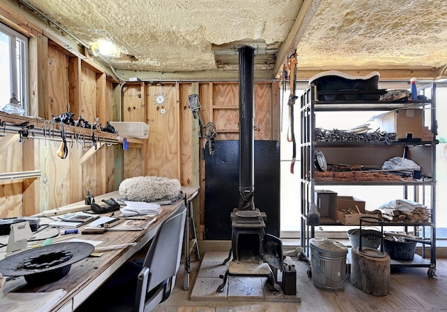 miscellaneous room featuring hardwood / wood-style floors and wood walls