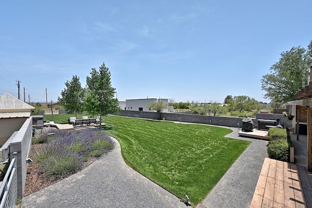 view of yard with a patio and a hot tub