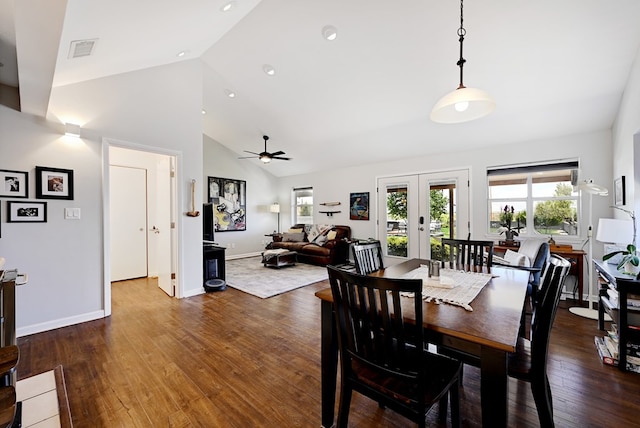 dining area featuring ceiling fan, french doors, high vaulted ceiling, and dark wood-type flooring