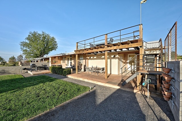 rear view of property with a yard, a patio area, and a pergola