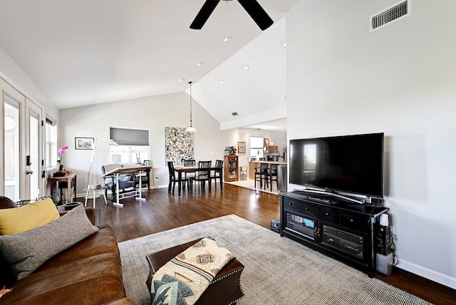 living room with hardwood / wood-style floors, french doors, high vaulted ceiling, and ceiling fan