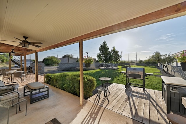 view of patio with a deck and ceiling fan