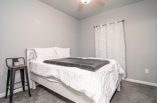 bedroom with ceiling fan and dark carpet