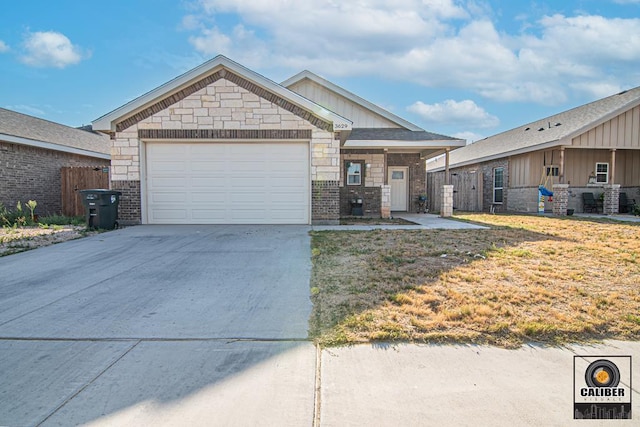 view of front facade with a front yard and a garage