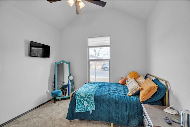 bedroom with light colored carpet, vaulted ceiling, and ceiling fan