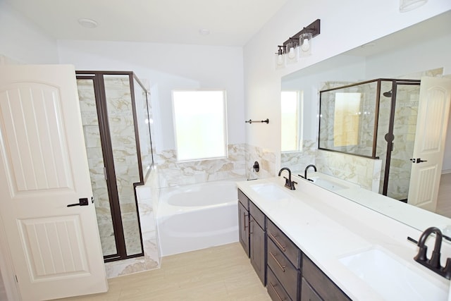 bathroom with plus walk in shower and vanity