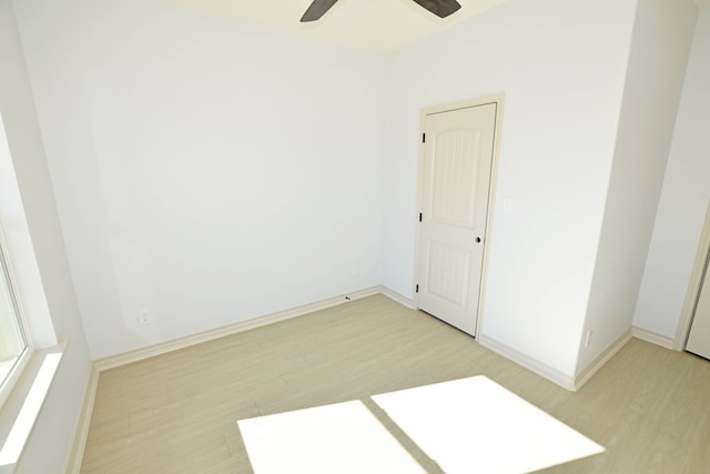 spare room featuring ceiling fan and light hardwood / wood-style floors