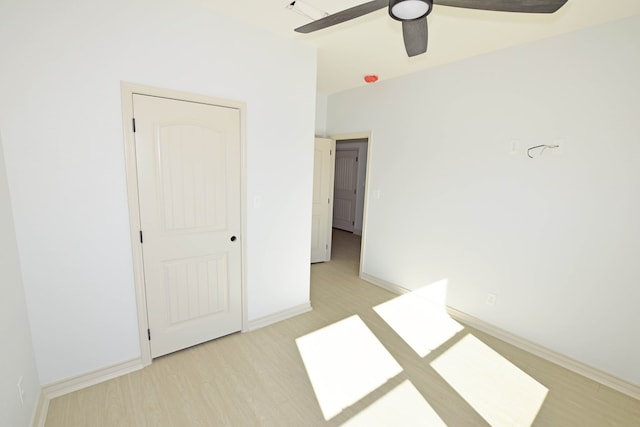 unfurnished bedroom with light hardwood / wood-style flooring and ceiling fan