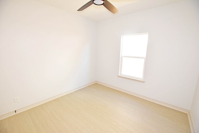 spare room featuring hardwood / wood-style flooring and ceiling fan