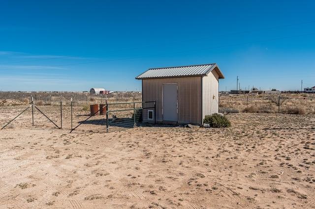 view of outdoor structure with a rural view