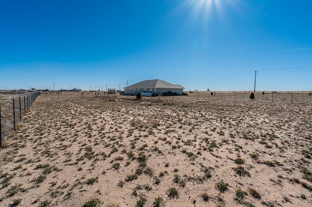 view of yard with a rural view