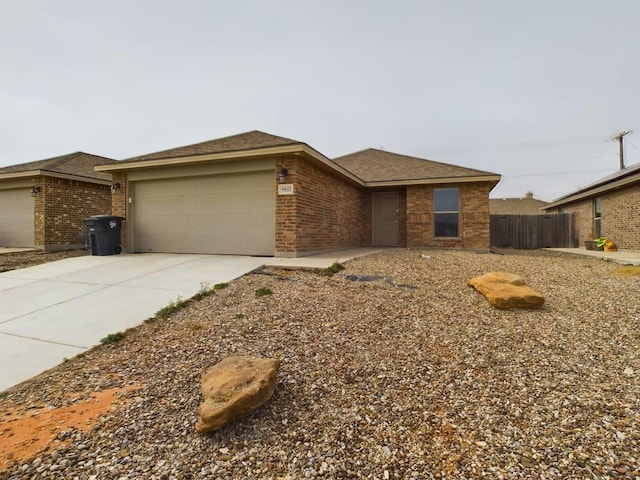 ranch-style home featuring a garage