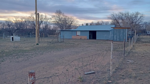 view of outdoor structure at dusk