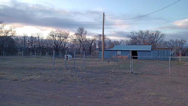 yard at dusk with an outdoor structure