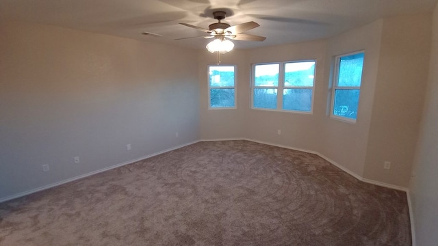 unfurnished room featuring ceiling fan and carpet