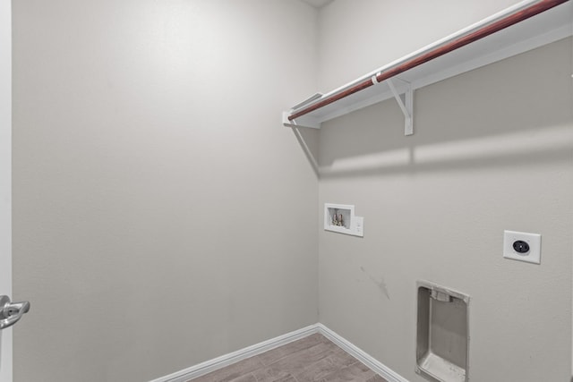 laundry area featuring electric dryer hookup, baseboards, hookup for a washing machine, and laundry area