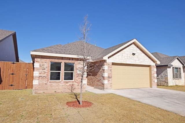 view of front facade with a garage and a front lawn