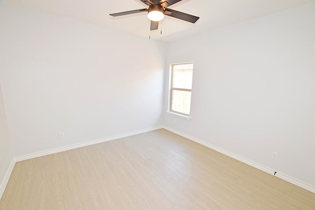 spare room with ceiling fan and light hardwood / wood-style floors