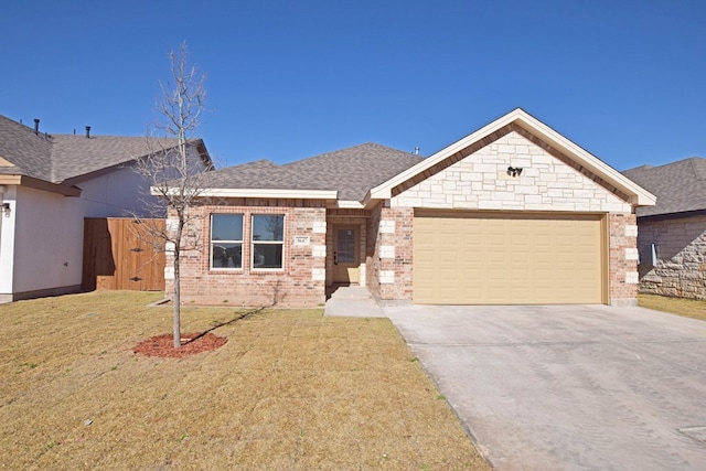 view of front of house with a garage and a front yard