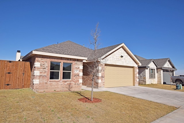 view of front of house with a garage and a front yard