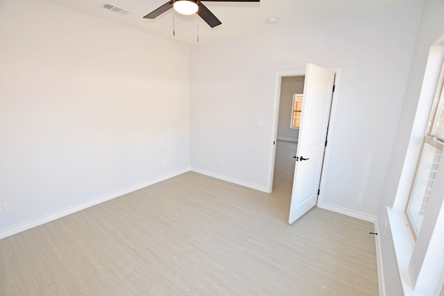 spare room with ceiling fan and light hardwood / wood-style floors