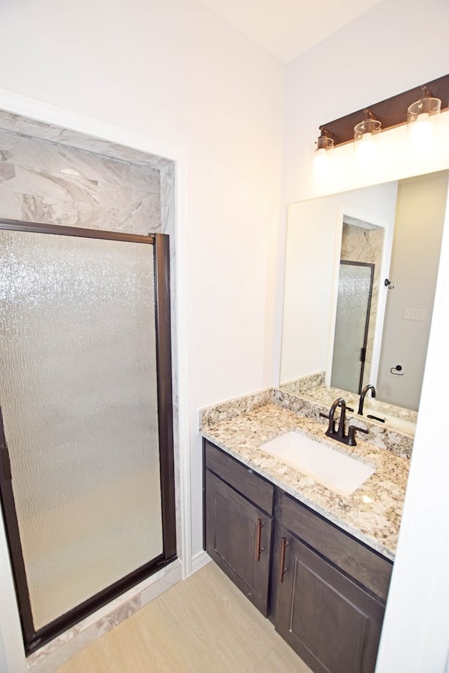 bathroom with vanity and walk in shower