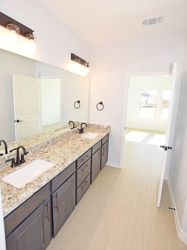 bathroom featuring vanity and wood-type flooring