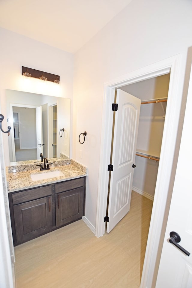 bathroom featuring vanity and hardwood / wood-style floors