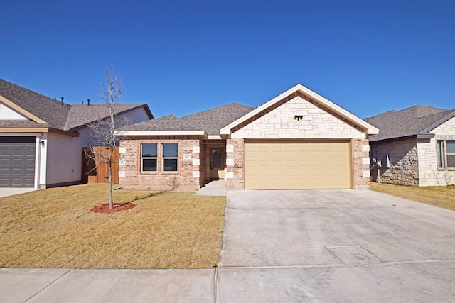 view of front of home with a garage and a front lawn