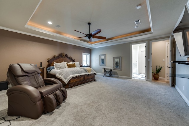 bedroom featuring a tray ceiling, ceiling fan, and light carpet