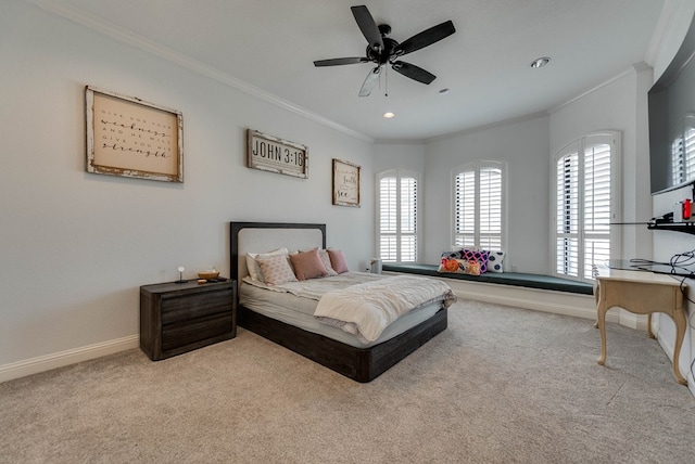 bedroom with ceiling fan, crown molding, and light carpet