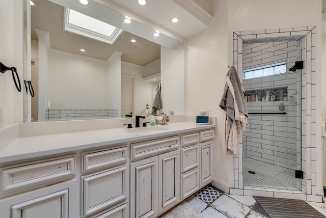 bathroom with vanity, an enclosed shower, ornamental molding, and a skylight