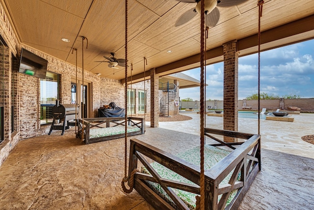 view of patio featuring ceiling fan