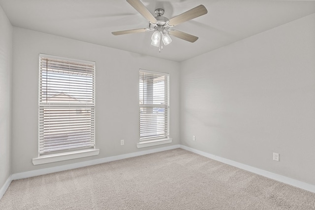 carpeted empty room with ceiling fan