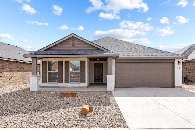 view of front of house featuring a porch and a garage