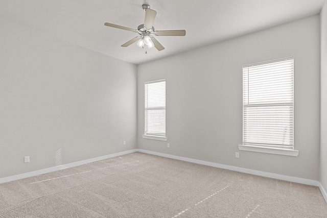 unfurnished room with carpet flooring and ceiling fan