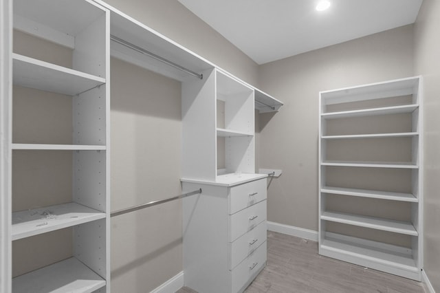 spacious closet featuring light wood-type flooring