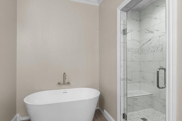 bathroom featuring shower with separate bathtub and crown molding