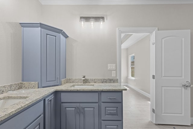 bathroom featuring vanity and crown molding