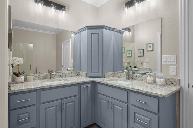 bathroom featuring vanity, an enclosed shower, and ornamental molding