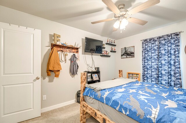 bedroom with ceiling fan and carpet floors