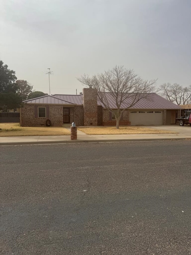 view of front of property with metal roof and a standing seam roof