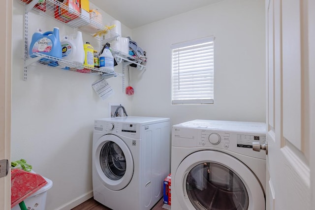 laundry room featuring washing machine and clothes dryer