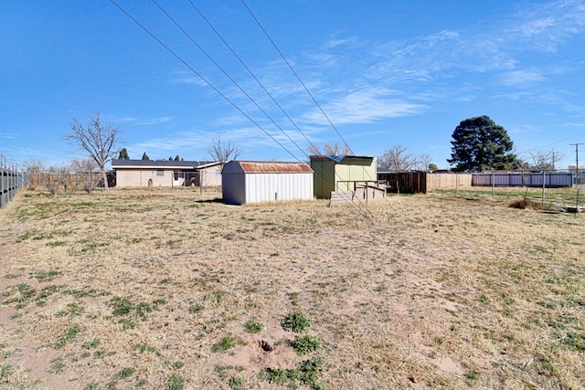 view of yard with a storage shed