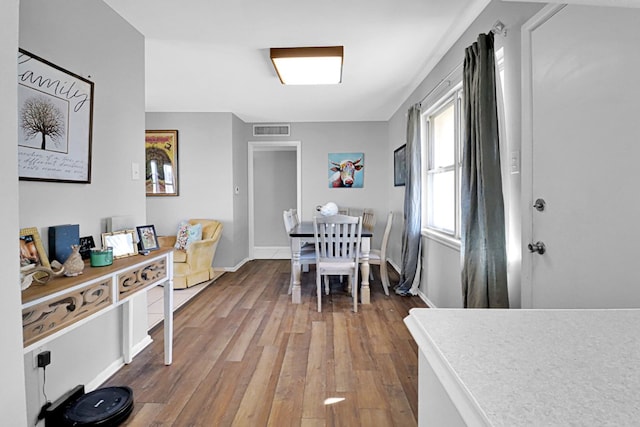 dining area with hardwood / wood-style flooring