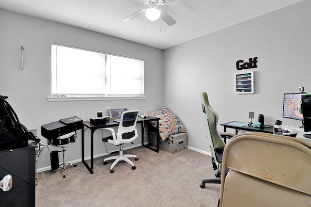 carpeted office featuring ceiling fan