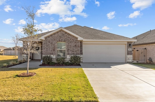 ranch-style house featuring a garage and a front yard