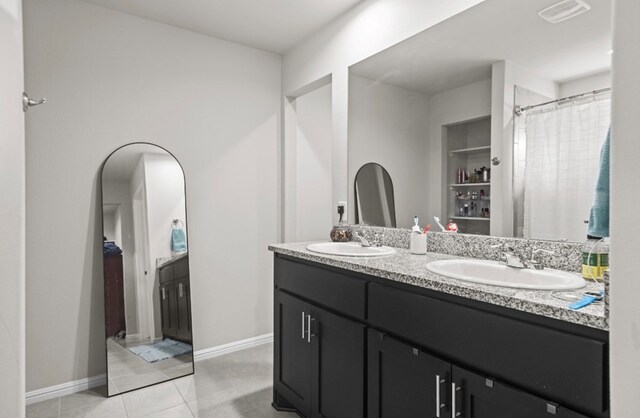 bathroom featuring vanity and tile patterned floors