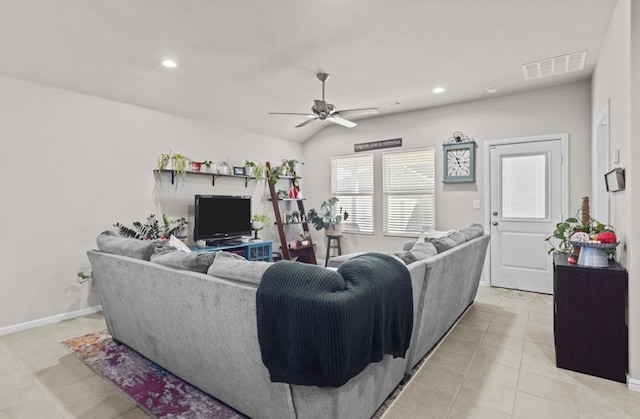 living room with vaulted ceiling, light tile patterned floors, and ceiling fan