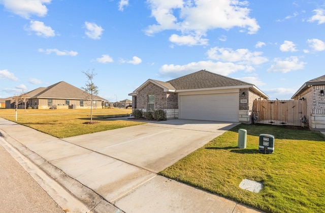 ranch-style home featuring a garage and a front lawn